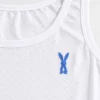 Close-up of breathable cotton innerwear texture and blue bunny embroidery on broad strap camisole.