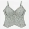 Geometric lace camisole designed as a padded camisole top with breathable stretch fabric.