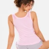 Model showing back view of wide strap camisole in pink camisole for women.