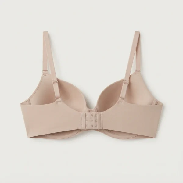 Back view of a nude padded push up bra showing adjustable straps and closure from Pixosum