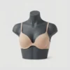 Tone-on-tone mannequin display of a seamless nude push up bra by Pixosum