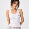 Model posing in wide strap camisole and white cotton shameez ladies slip.